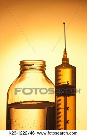Bottle with water and syringe View Large Photo Image Stock Photograph - Bottle with water and syringe. Fotosearch