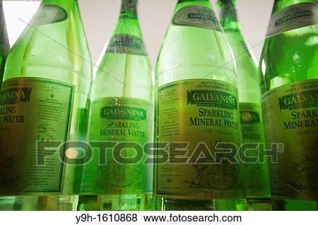 Stock Photo - Bottled water from Italy is seen in the window of a restaurant in New York. Fotosearch