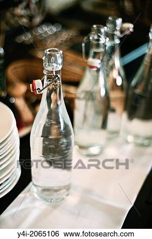 Bottles of water. Cafe Tupina. French cafe in Bordeaux. Bordeaux. Gironde. Aquitaine. France. Europe. View Large Photo Image Stock Photograph - Bottles of water. Cafe Tupina. French cafe in Bordeaux. Bordeaux. Gironde. Aquitaine. France. Europe.. Fotosearch