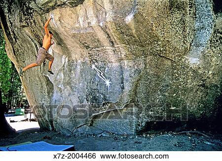 bouldering a world famous rock climb called Midnight Lightning which is rated V, 7 and located on the Columbia Boulder in Yosemite Valley at Yosemite National Park in California. View Large Photo Image Stock Photograph - bouldering a world famous rock climb called Midnight Lightning which is rated V, 7 and located on the Columbia Boulder in Yosemite Valley at Yosemite National Park in California.. Fotosearch