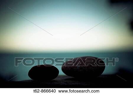 Stock Image - Boulders in a blue horizon. Fotosearch