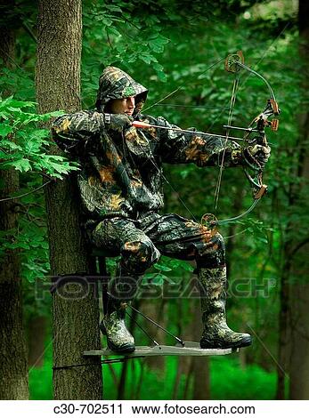 Stock Image - Bow & arrow hunter. Fotosearch