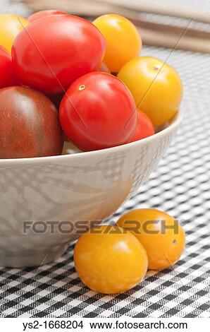 Bowl with different kinds of tomatoes View Large Photo Image Picture - Bowl with different kinds of tomatoes. Fotosearch