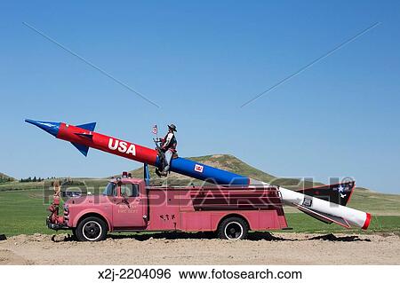 Stock Photograph - Bowman, North Dakota - A missile mounted on an antique fire truck.. Fotosearch