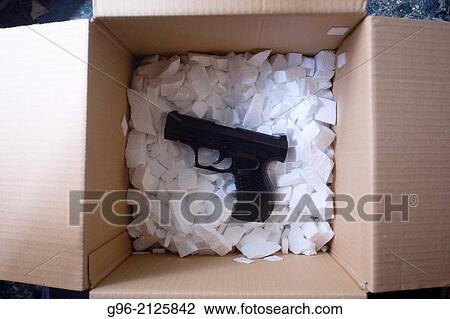 Box with handgun. View Large Photo Image Stock Image - Box with handgun.. Fotosearch