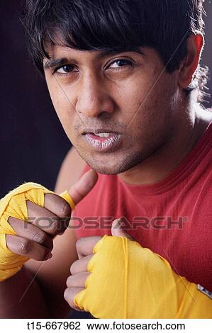 Boxer preparing mental toughness without boxing gloves View Large Photo Image Stock Image - Boxer preparing mental toughness without boxing gloves. Fotosearch