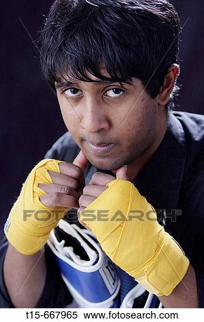 Stock Photography - Boxer preparing mental toughness without boxing gloves. Fotosearch