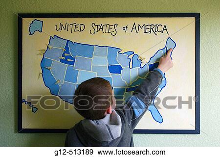 Boy, 5, pointing to a homemade map of USA on wall in his bedroom. View Large Photo Image Stock Photo - Boy, 5, pointing to a homemade map of USA on wall in his bedroom.. Fotosearch