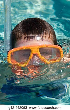 Boy, 5, using goggles, mask, and snorkel in pool. McCall, Idaho. USA View Large Photo Image Stock Image - Boy, 5, using goggles, mask, and snorkel in pool. McCall, Idaho. USA. Fotosearch