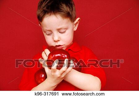 Stock Image - Boy About to Drop Apples. Fotosearch
