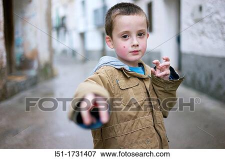 Boy adopting martial art posture on the street, Ludiente, Castell? n, Spain View Large Photo Image Stock Photo - Boy adopting martial art posture on the street, Ludiente, Castell? n, Spain. Fotosearch
