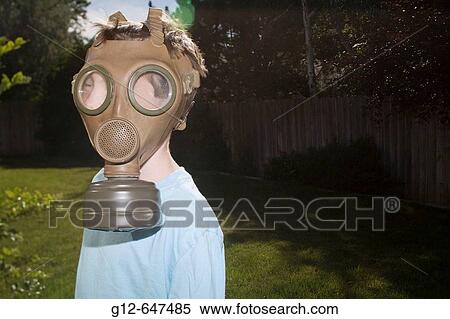 Boy, age 7, wears vintage military gas mask. View Large Photo Image Stock Photography - Boy, age 7, wears vintage military gas mask.. Fotosearch