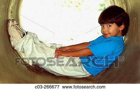 Stock Photo - Boy amusing himself. Laguna Beach. California. USA. Fotosearch