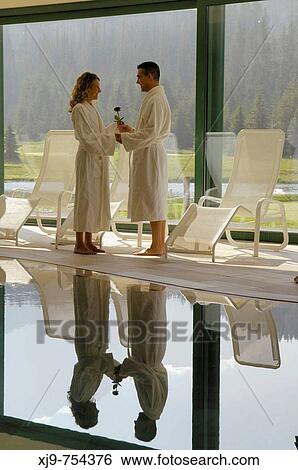 Stock Photograph - Boy and girl in an SPA on the Alps.. Fotosearch