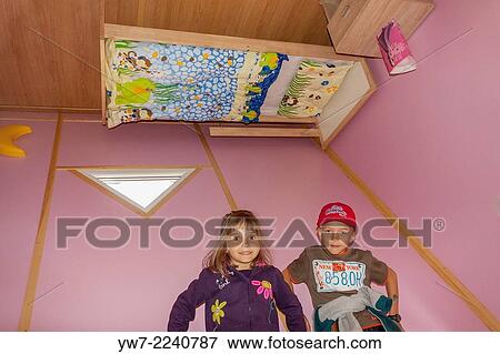 Boy and girl inside upside-down house in Jastrzebia G? ra, Poland. View Large Photo Image Stock Photo - Boy and girl inside upside-down house in Jastrzebia G? ra, Poland.. Fotosearch