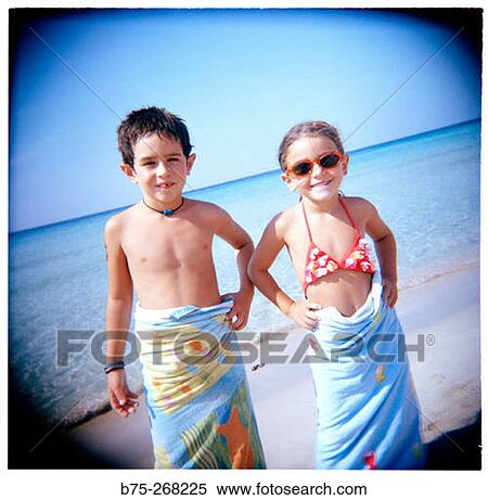 Boy and girl on the beach View Large Photo Image Stock Photography - Boy and girl on the beach. Fotosearch