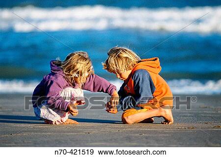 Boy and girl playing on beach. Buenos Aires. Argentina View Large Photo Image Stock Photo - Boy and girl playing on beach. Buenos Aires. Argentina. Fotosearch