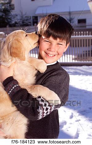 Boy and Golden Retriever puppy View Large Photo Image Stock Image - Boy and Golden Retriever puppy. Fotosearch