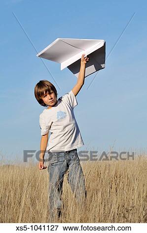 Stock Photo - Boy and paper plane. Fotosearch