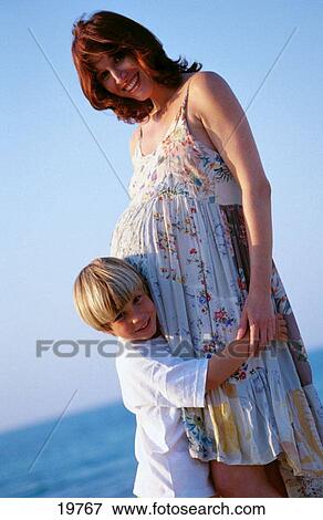 Boy and pregnant mother View Large Photo Image Stock Photo - Boy and pregnant mother. Fotosearch
