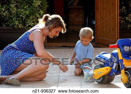 Boy and woman at play. View Large Photo Image Stock Photo - Boy and woman at play.. Fotosearch