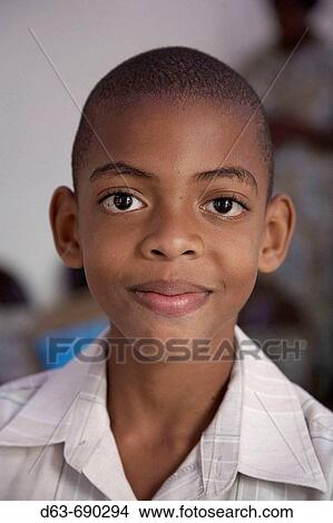 Boy at Sunday mass at Catholic church in Chester Castle. Jamaica View Large Photo Image Picture - Boy at Sunday mass at Catholic church in Chester Castle. Jamaica. Fotosearch
