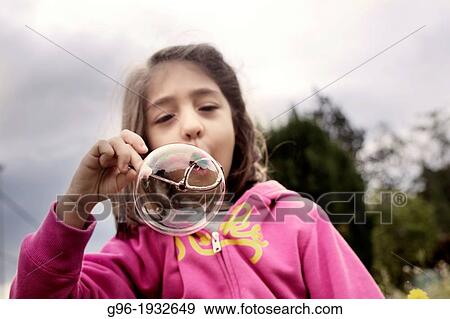 Boy blowing soap bubbles View Large Photo Image Stock Photo - Boy blowing soap bubbles. Fotosearch