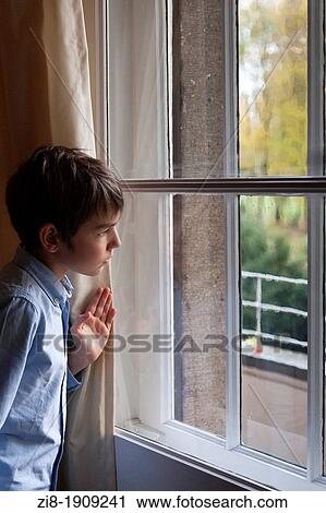 Stock Image - Boy by the window. Fotosearch