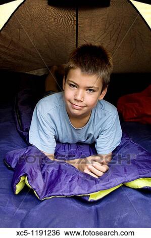 Boy camping, summer time, Montseny Natural Park, Barcelona, Catalonia, Spain View Large Photo Image Stock Photograph - Boy camping, summer time, Montseny Natural Park, Barcelona, Catalonia, Spain. Fotosearch