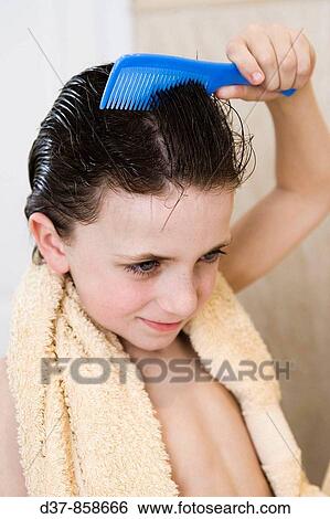 Boy combing himself View Large Photo Image Stock Photograph - Boy combing himself. Fotosearch