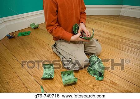 Boy counting paper money. View Large Photo Image Stock Photograph - Boy counting paper money.. Fotosearch