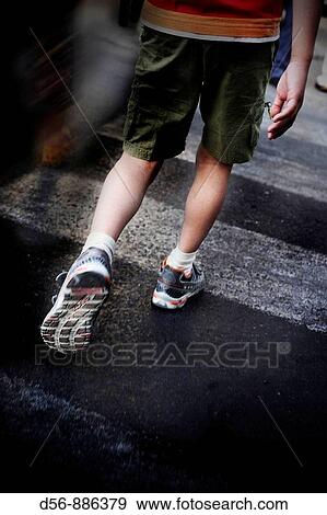 Boy crossing the street View Large Photo Image Stock Photo - Boy crossing the street. Fotosearch