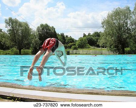 Boy diving in a pool. View Large Photo Image Stock Image - Boy diving in a pool.. Fotosearch