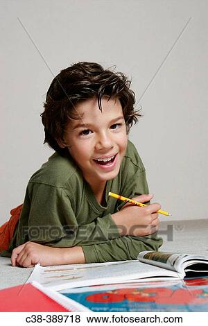 Boy Doing Homework View Large Photo Image Stock Photo - Boy Doing Homework. Fotosearch