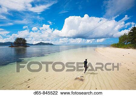 Boy dragging caught squid, L? Union Estate Plantation, La Digue island, Seychelles View Large Photo Image Stock Image - Boy dragging caught squid, L? Union Estate Plantation, La Digue island, Seychelles. Fotosearch