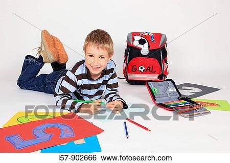 boy drawing with coloured pencils, surrounded by papier and satchel, white background, Studio, Switzerland View Large Photo Image Stock Photograph - boy drawing with coloured pencils, surrounded by papier and satchel, white background, Studio, Switzerland. Fotosearch