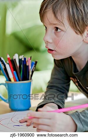 Boy draws with crayons indoor. View Large Photo Image Stock Image - Boy draws with crayons indoor.. Fotosearch