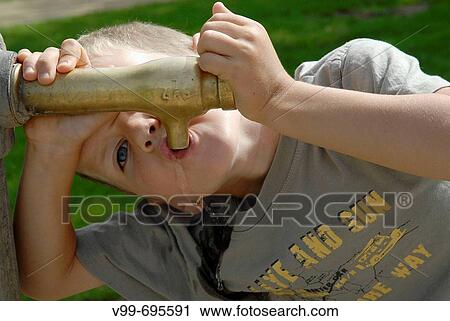 Boy drinking at fountain View Large Photo Image Stock Image - Boy drinking at fountain. Fotosearch