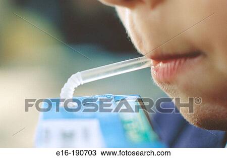 Boy drinking juice View Large Photo Image Stock Image - Boy drinking juice. Fotosearch