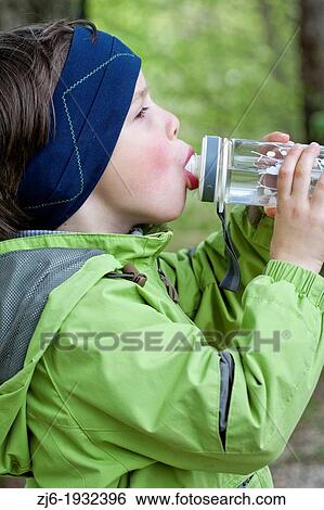 Boy drinking water. View Large Photo Image Stock Photograph - Boy drinking water.. Fotosearch