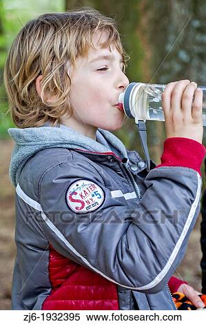 Boy drinking water. View Large Photo Image Stock Photography - Boy drinking water.. Fotosearch