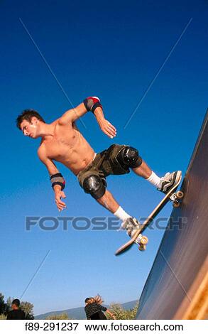 Boy dropping in on skateboard on half pipe. Mount Vernon. Washington, USA View Large Photo Image Stock Photo - Boy dropping in on skateboard on half pipe. Mount Vernon. Washington, USA. Fotosearch
