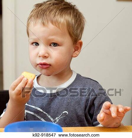 Boy eating a peach View Large Photo Image Stock Photo - Boy eating a peach. Fotosearch
