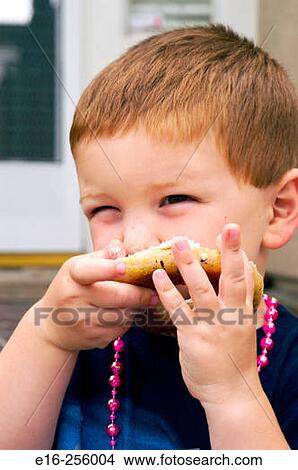 boy eating bagel View Large Photo Image Picture - boy eating bagel. Fotosearch