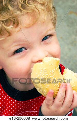 boy eating bagel View Large Photo Image Stock Photo - boy eating bagel. Fotosearch