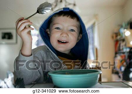 Boy eating cereals View Large Photo Image Stock Photo - Boy eating cereals. Fotosearch