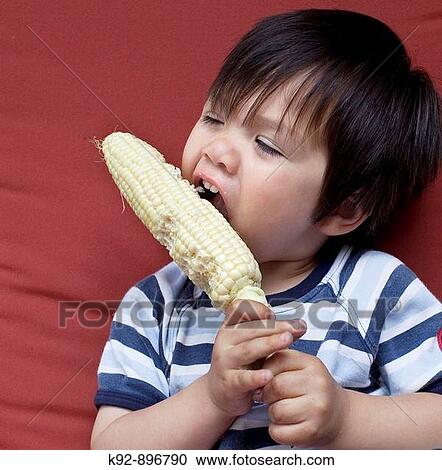 Boy eating healthy food View Large Photo Image Stock Image - Boy eating healthy food. Fotosearch