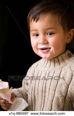 Boy eating icecream in a cone Iceland View Large Photo Image Stock Photo - Boy eating icecream in a cone Iceland. Fotosearch
