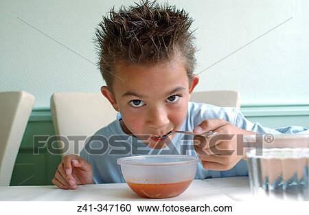 Boy eating soup View Large Photo Image Stock Image - Boy eating soup. Fotosearch