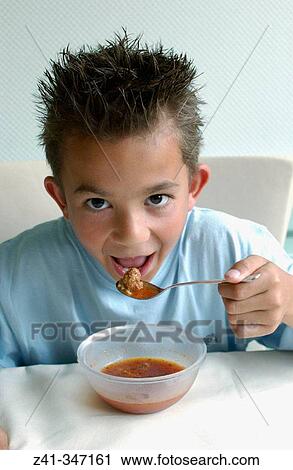 Boy eating stew View Large Photo Image Stock Image - Boy eating stew. Fotosearch